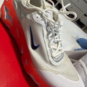 Nike White Sneakers with Blue Swoosh and Red Sole
